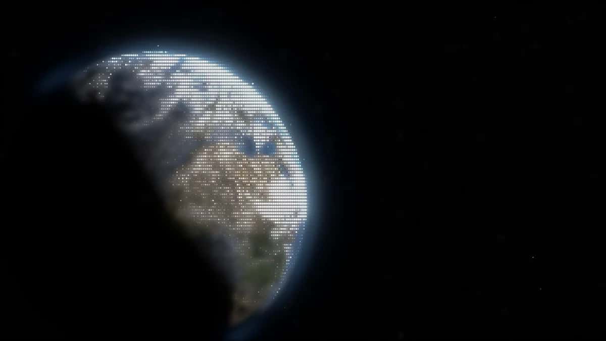 Earth globe illuminated against black space, partial view showing clouds, oceans, continents in blue and tan tones