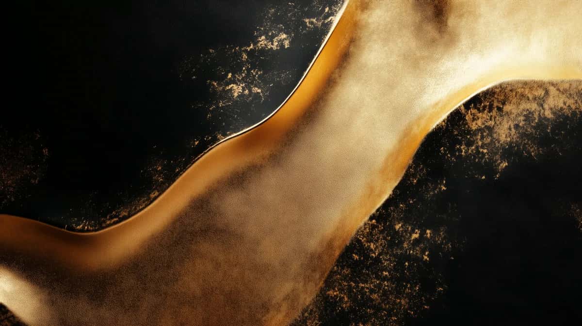 Molten gold ribbon curving across deep black with scattered gold dust