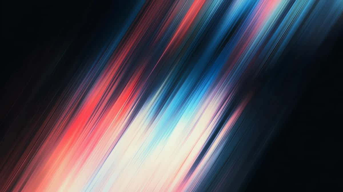 Abstract diagonal light streaks in red, blue, and white colors blending across dark background