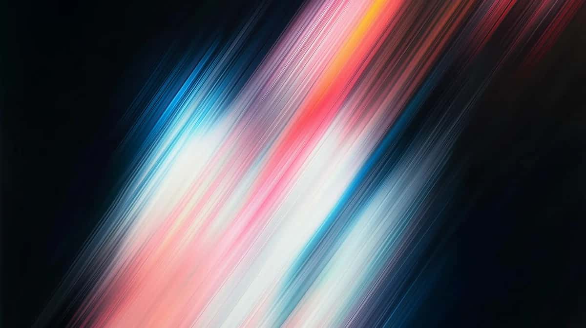 Diagonal motion blur streaks in blue, pink, orange, and white on dark background