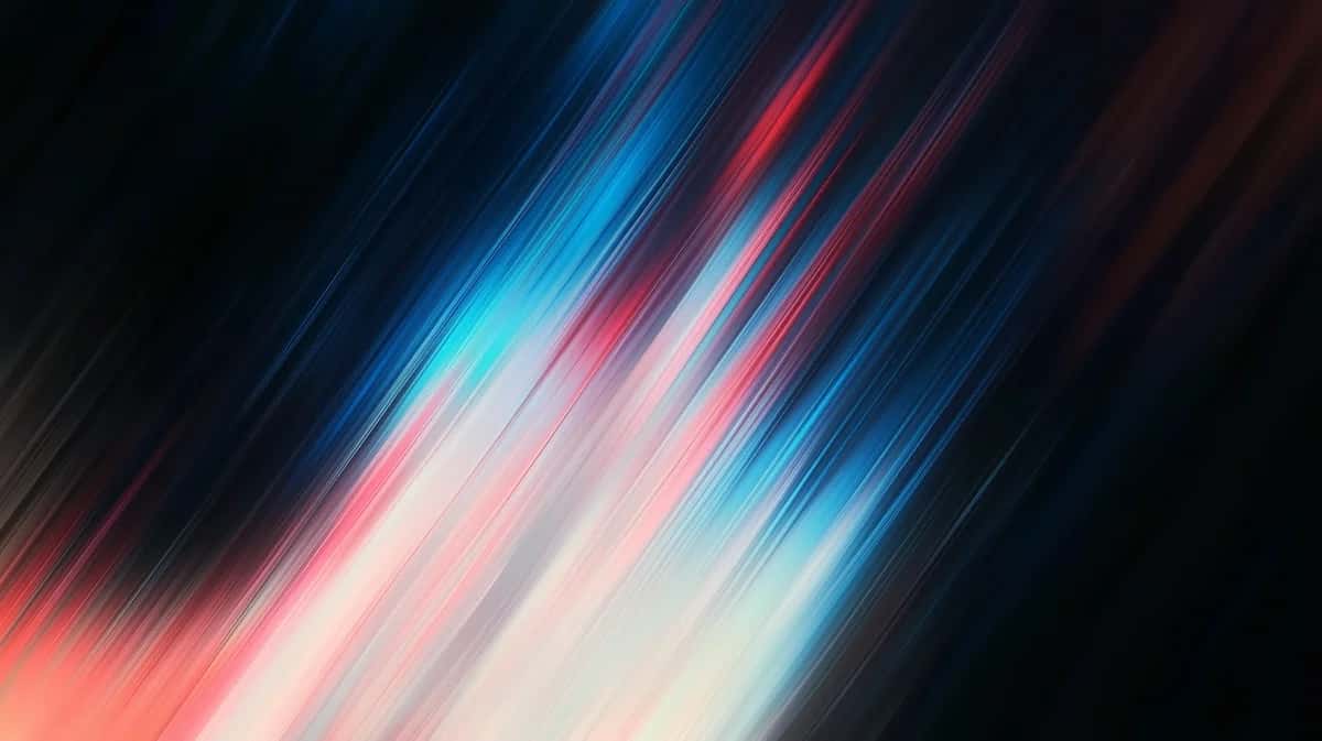 Diagonal motion blur streaks in blue, pink, and white on dark background