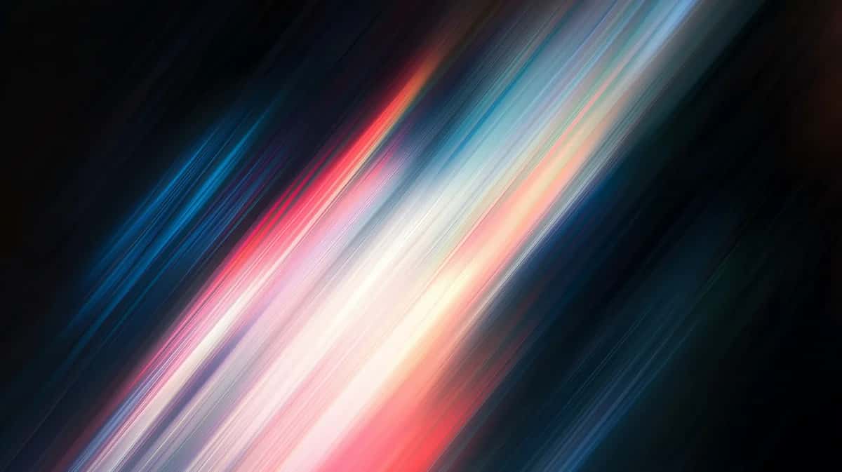 Diagonal light streaks in blue, pink, and cream tones on dark background