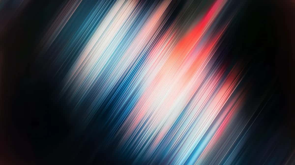 diagonal streaking gradient with blue, white, pink, and red colors on dark background