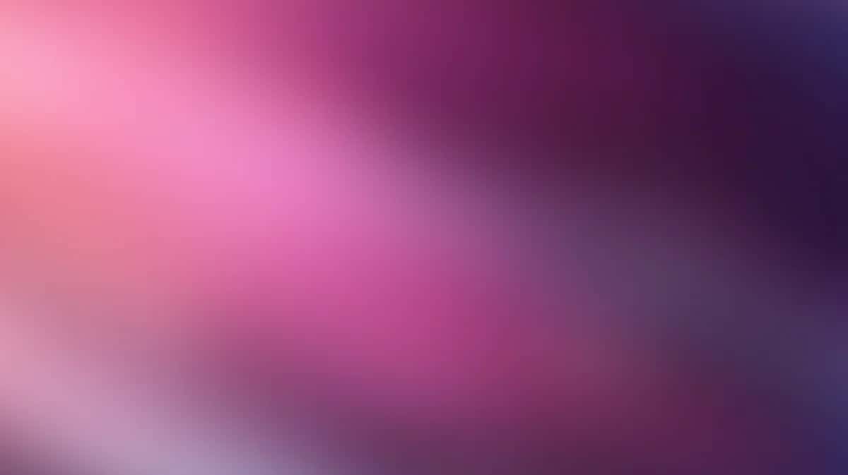 Soft gradient background transitioning from pink to purple with blurred light effect