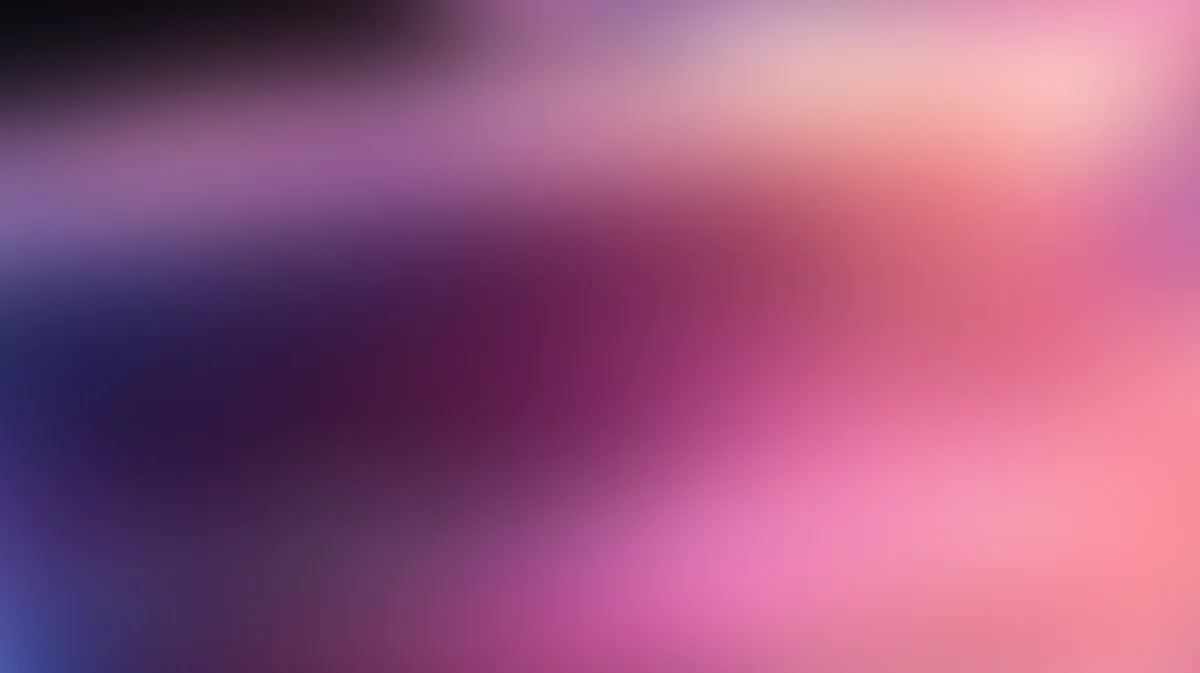 Soft gradient background transitioning from deep blue and purple to pink and coral