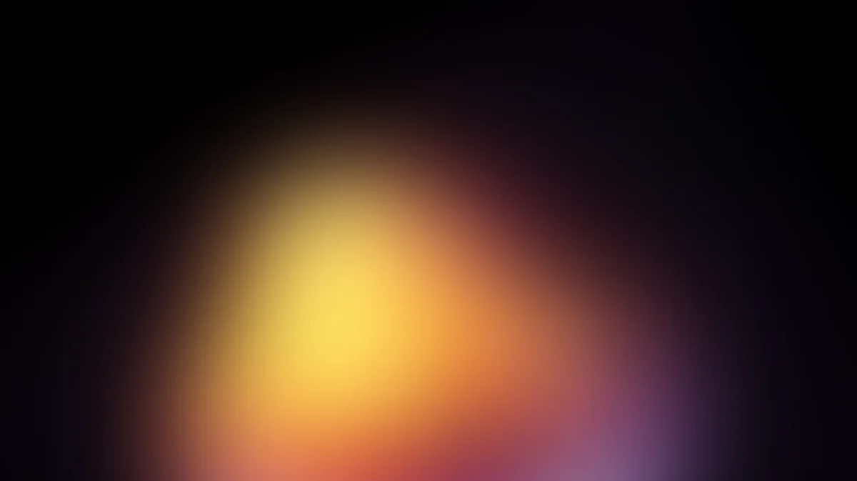 Warm yellow orange gradient radiating from center against dark black background, soft blurred light