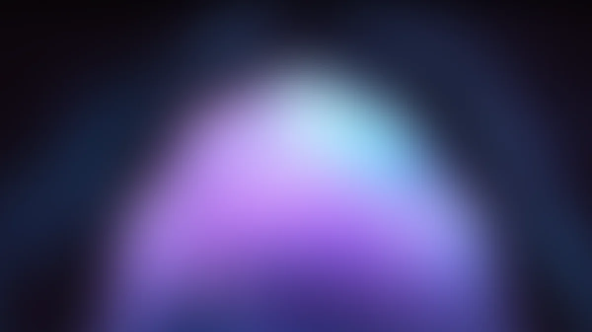 Blurred gradient sphere with purple, blue, and pink glowing light on dark background