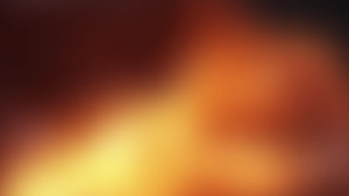 Abstract warm gradient background with orange, yellow, and deep red tones, soft blurred transition