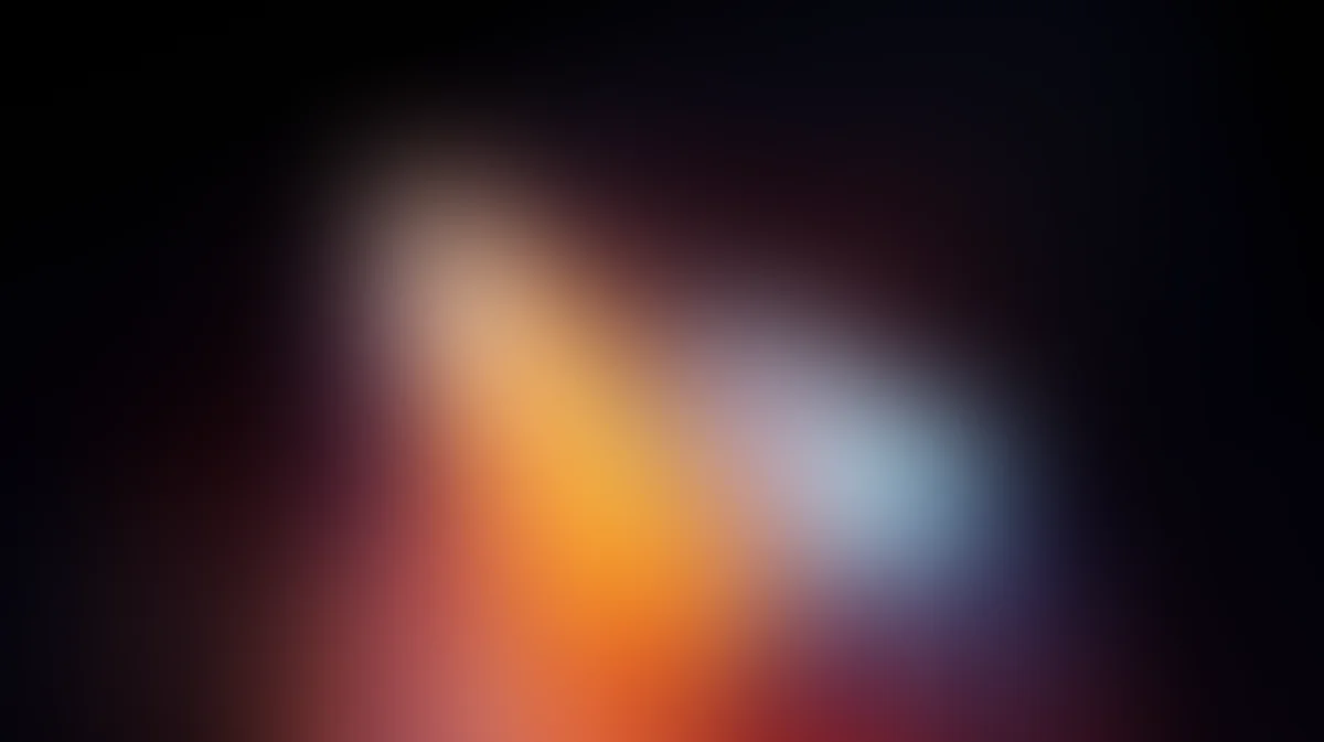 Abstract gradient background with orange yellow and blue light rays blending on dark backdrop