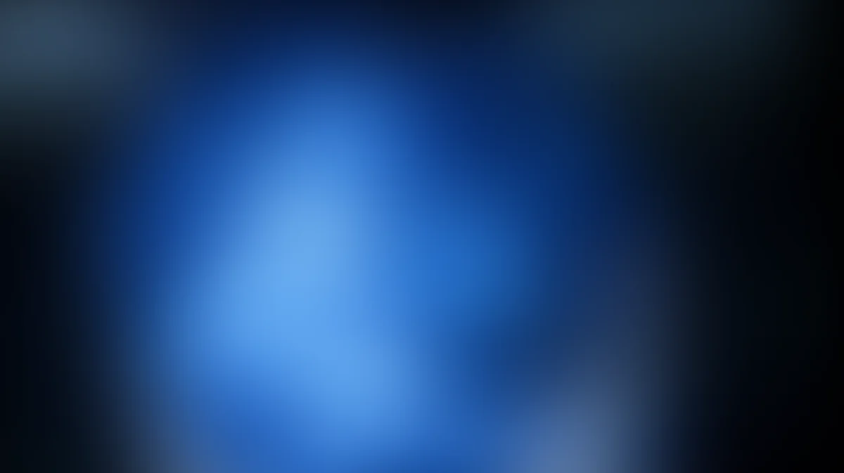 Abstract blue gradient background with radial light burst, dark edges, soft blur effect