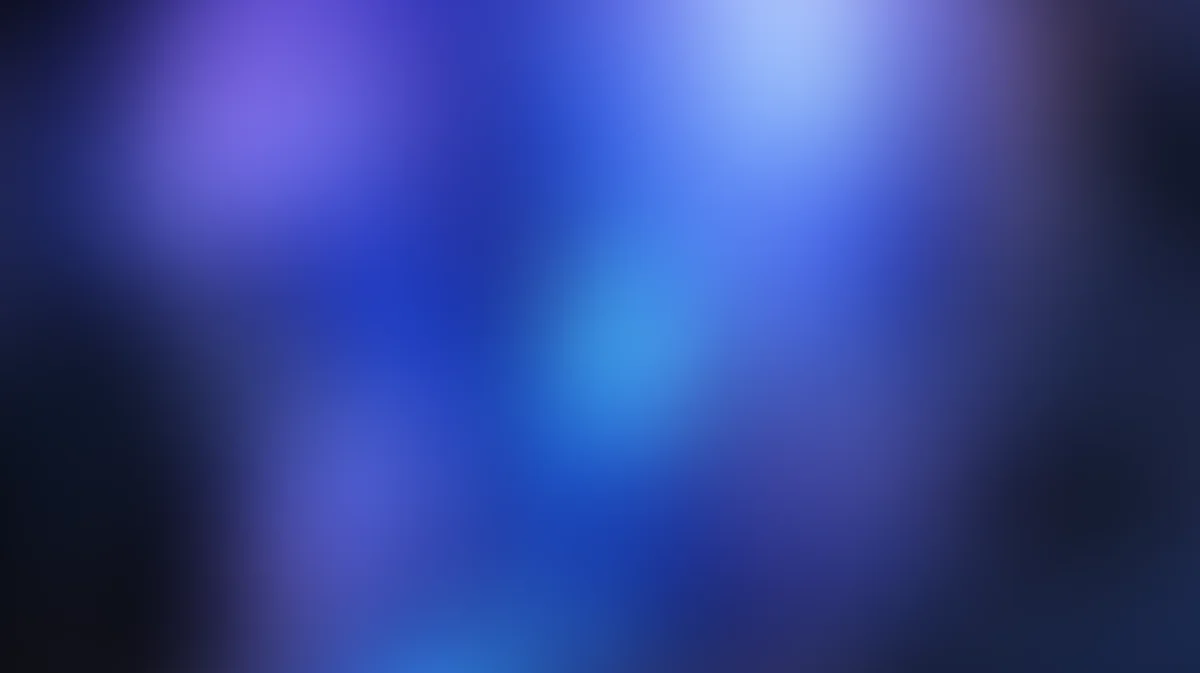 Abstract blurred gradient background with deep blue and purple tones, soft light diffusion