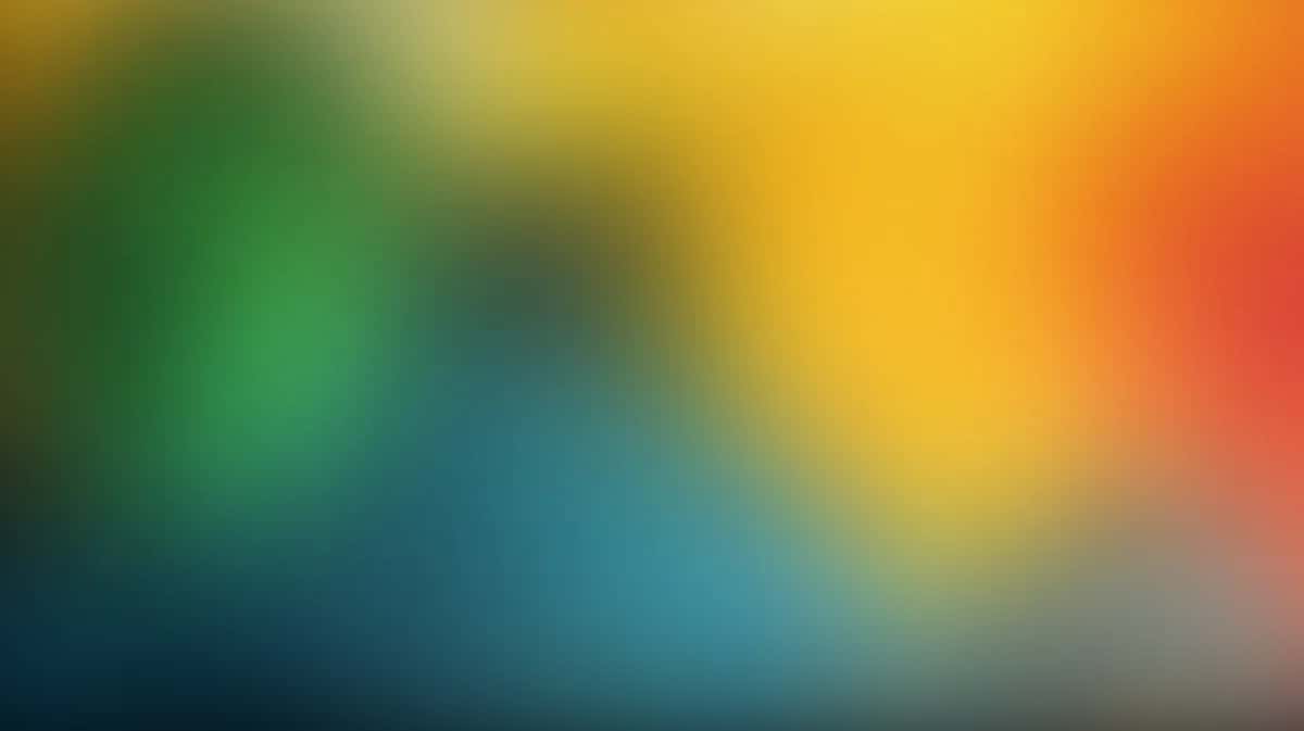 Soft blur gradient background transitioning from green through blue, yellow, orange to red