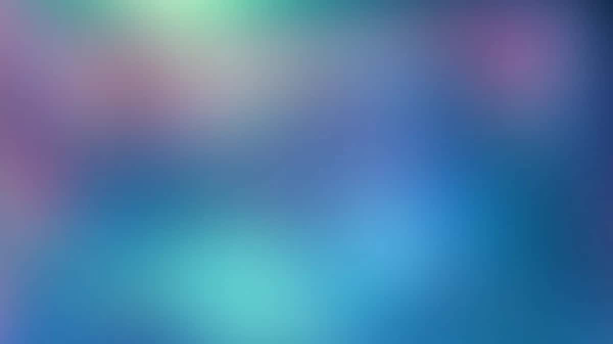 Soft blurred gradient background transitioning from purple and pink to blue and cyan tones