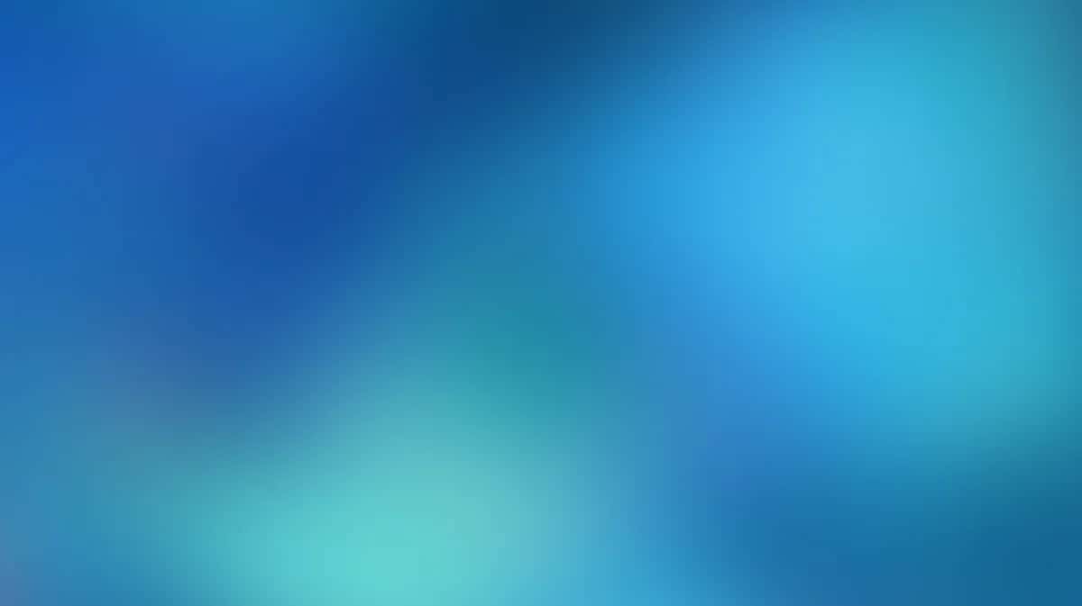 Soft blue and teal gradient background with blurred light effects and smooth color transitions