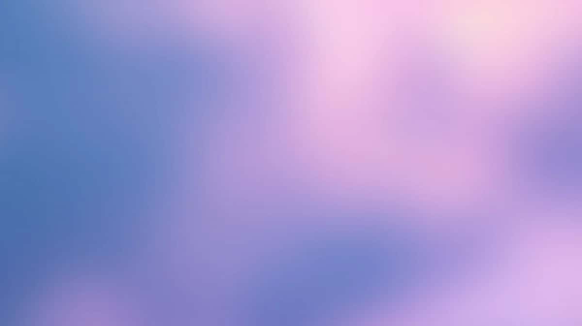 Soft gradient background blending blue, pink, and purple hues with blurred cloud-like forms