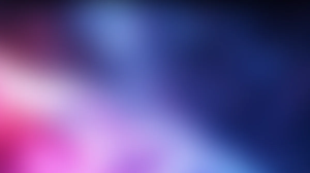 Blurred gradient background transitioning from pink and magenta to blue and dark navy