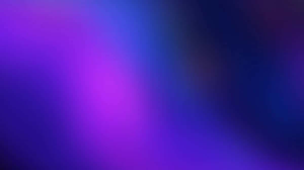 Smooth gradient background transitioning from vibrant magenta and purple to deep blue and black