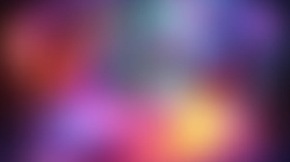 Soft blurred gradient background with purple, pink, orange, and yellow light blobs