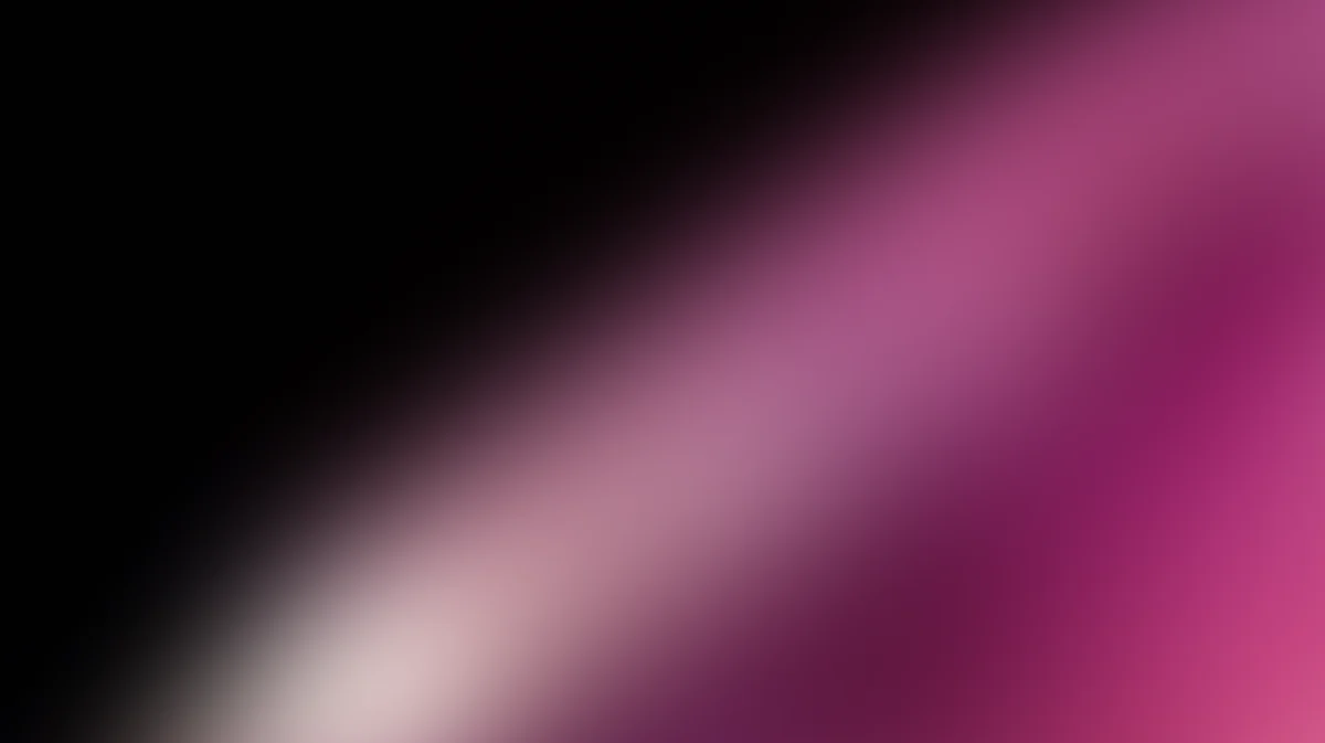 Abstract gradient wallpaper transitioning from black to pink with soft, blurred light effect