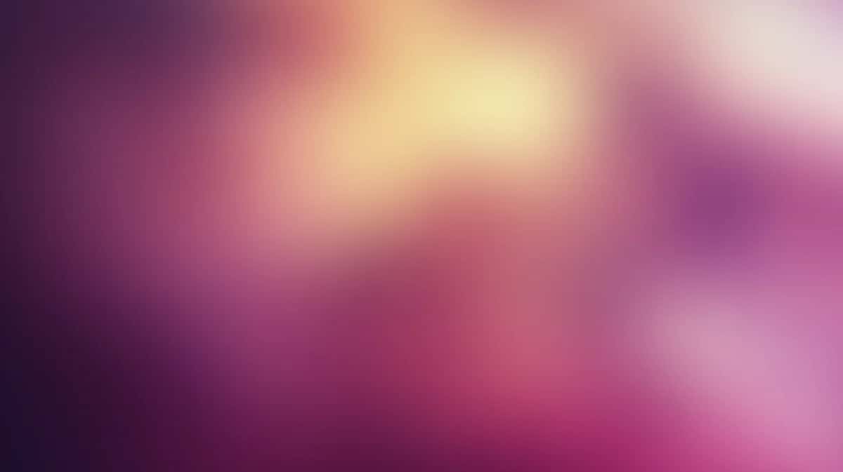 Soft blurred gradient background with purple, pink, and warm yellow hues blending smoothly