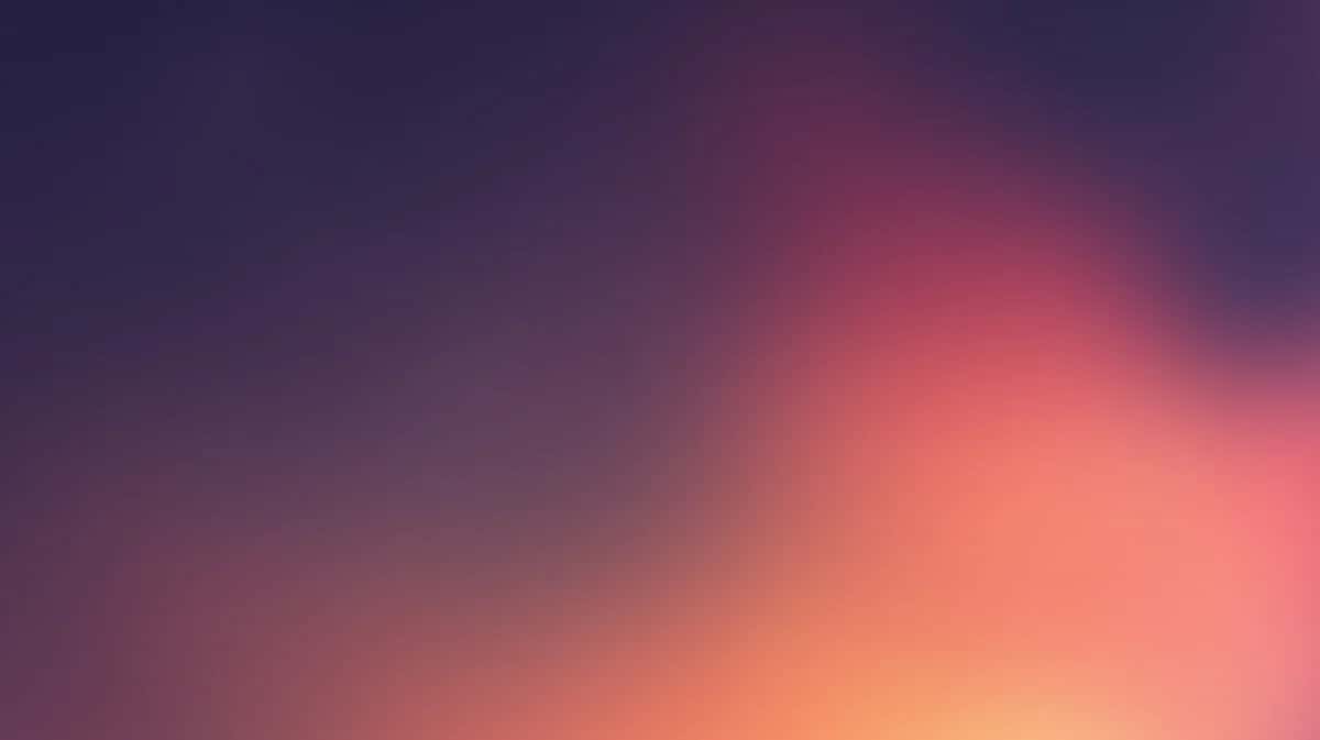 Soft gradient background transitioning from deep purple to warm coral and peach tones