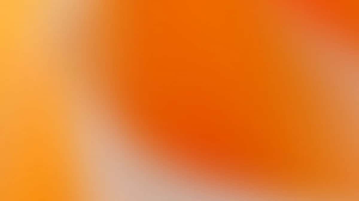 Orange gradient background with soft blurred diagonal light effect