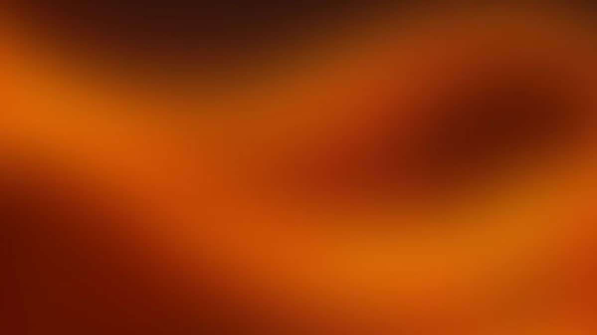 Abstract warm gradient background transitioning from deep orange to brown with soft blurred edges