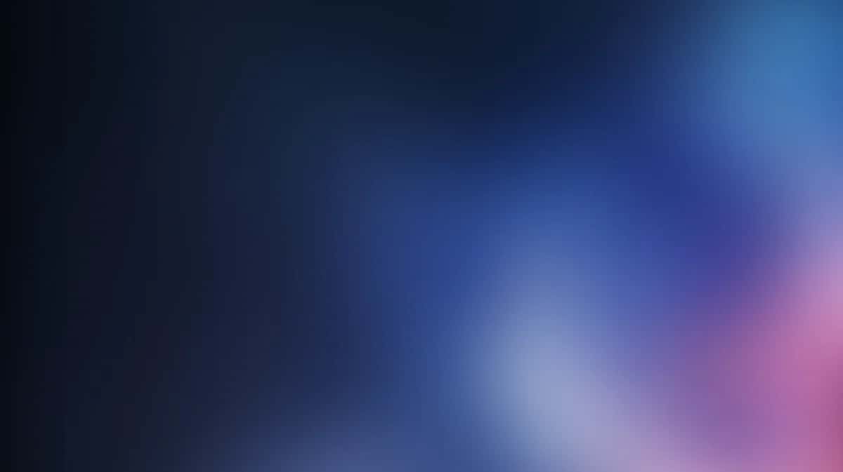Abstract gradient background with blue and pink hues, soft blurred light effects