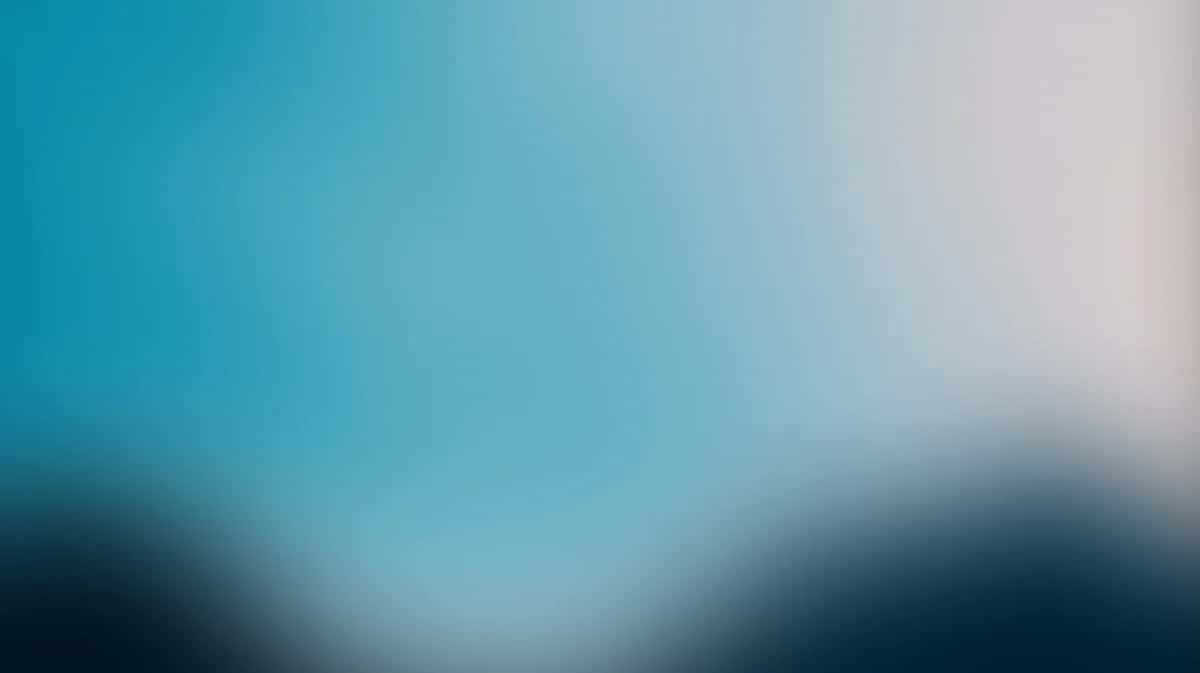 Soft gradient background transitioning from teal blue to pale pink with dark silhouettes