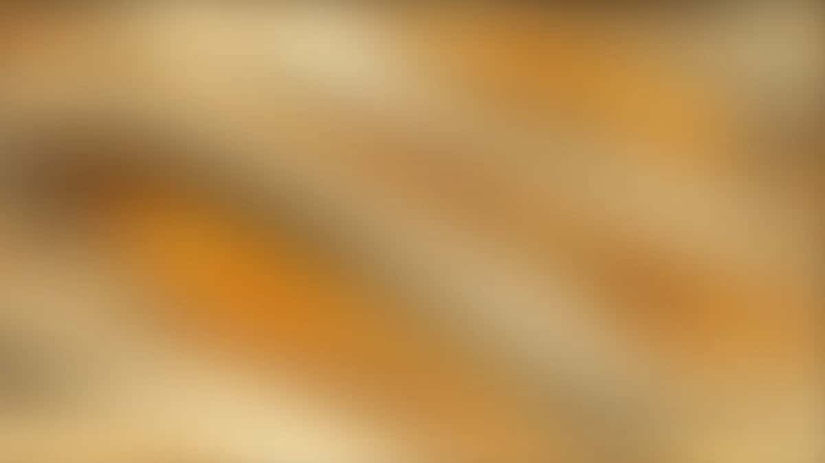 Soft blurred gradient background with warm golden orange and cream tones, diagonal flow
