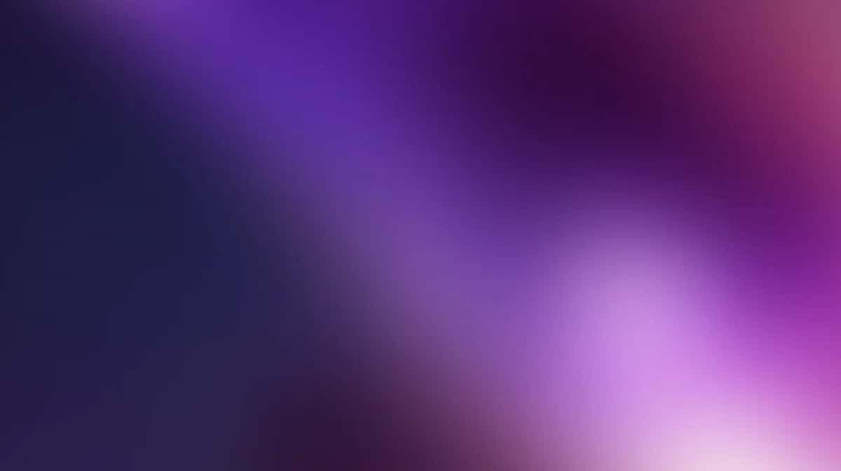 Abstract purple gradient background with soft blurred light transitions, dark to bright