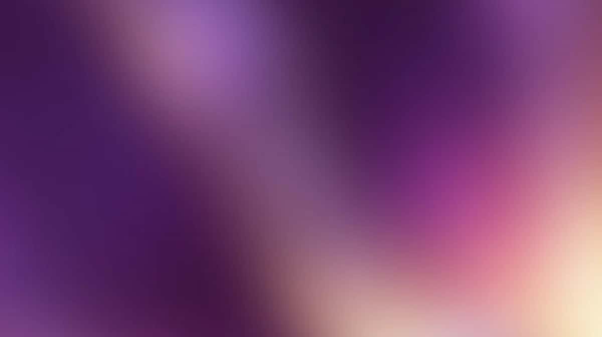 Abstract gradient background transitioning from deep purple to soft pink and cream, blurred and diffused