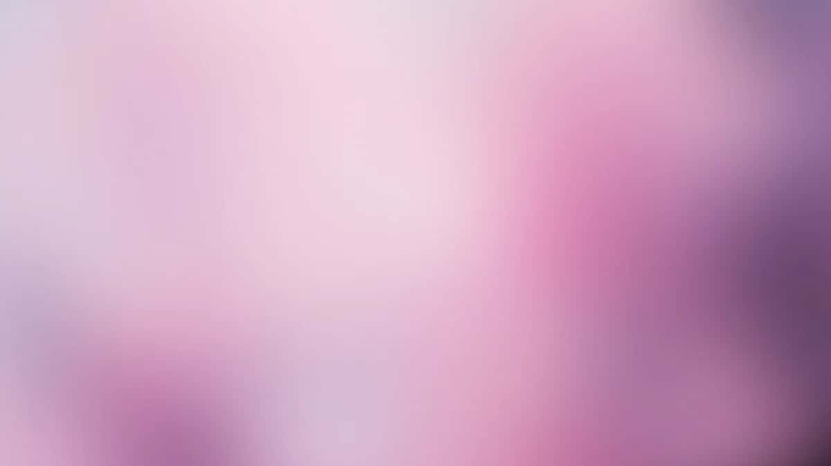 Soft pink and purple gradient background with blurred bokeh effect, dreamy and ethereal composition