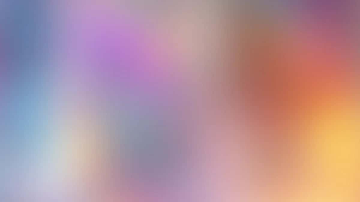 Soft blurred gradient background transitioning blue pink orange yellow