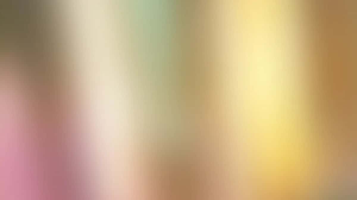 Soft gradient wallpaper blending pink, cream, yellow, and tan in vertical color shift