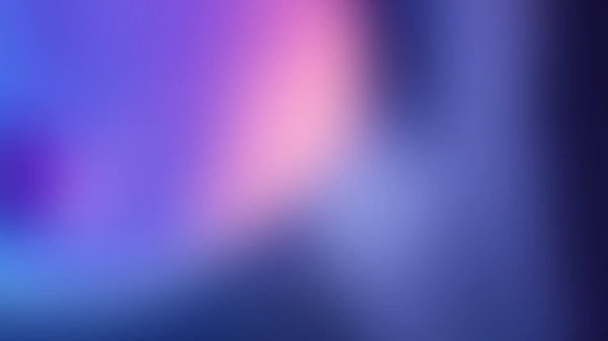 Abstract gradient background blending purple, pink, and blue with soft bokeh blur effect