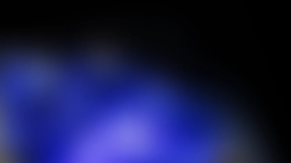 Abstract blue gradient background with soft blurred light effects and dark edges