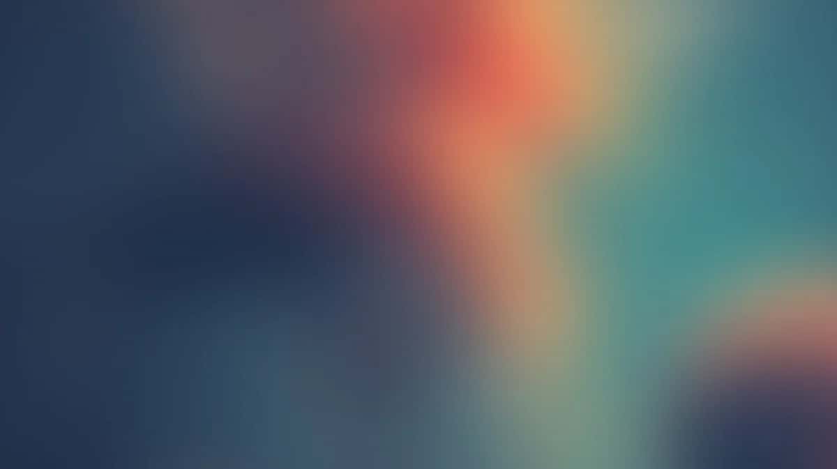 Abstract gradient wallpaper with soft blue, orange, and teal colors blending seamlessly