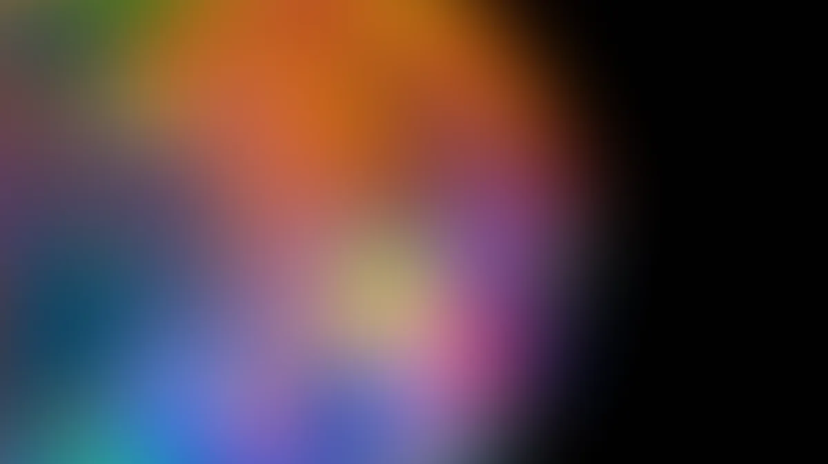 Soft blurred gradient background with orange, blue, purple, and teal colors blending seamlessly