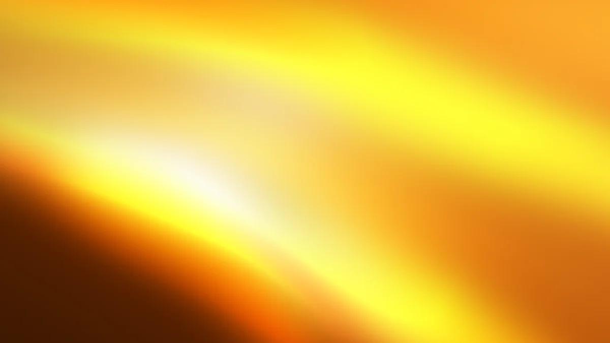 Golden yellow gradient background with soft light rays and warm color transition