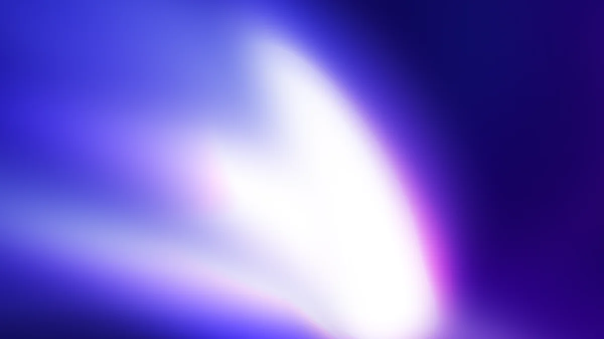 Abstract blurred gradient with white center light radiating through deep blue and purple tones