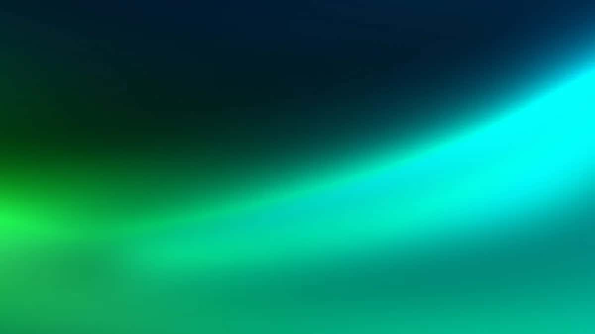 Luminous gradient transitioning from deep teal to bright cyan with soft glowing light effects
