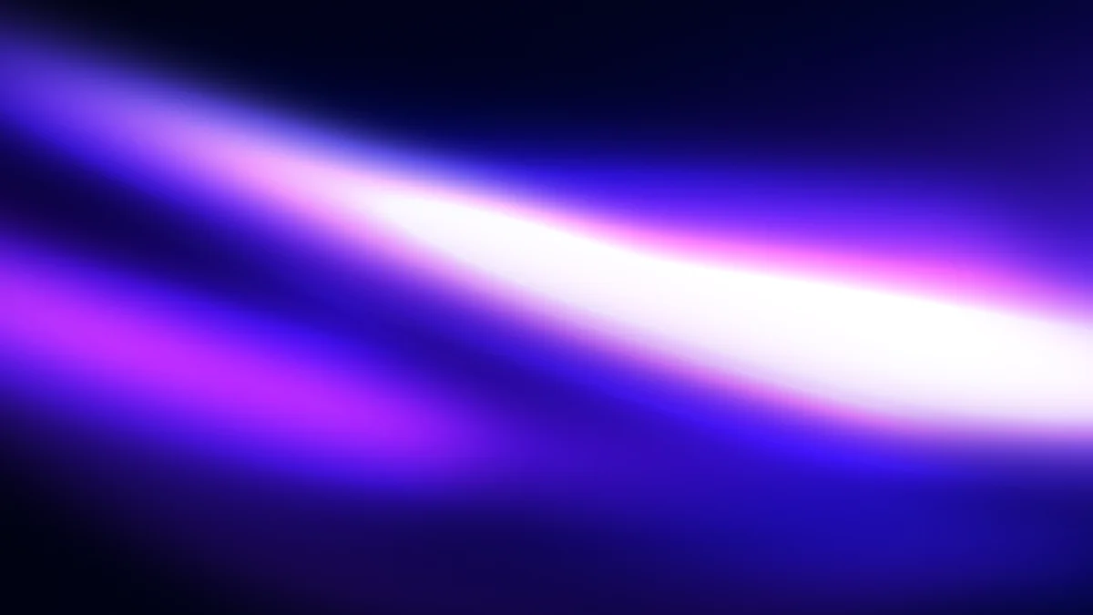 Abstract gradient blur with purple, blue, and white diagonal light streaks on dark background