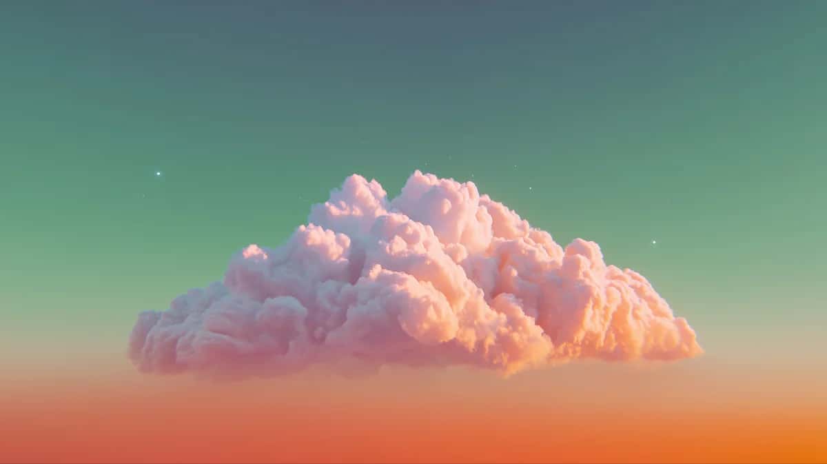 Ethereal pink and orange cloud formation floating against turquoise gradient sky at sunset