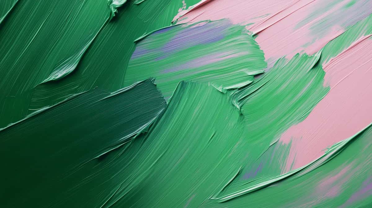 Abstract green paint strokes on pink background, fluid brushwork composition