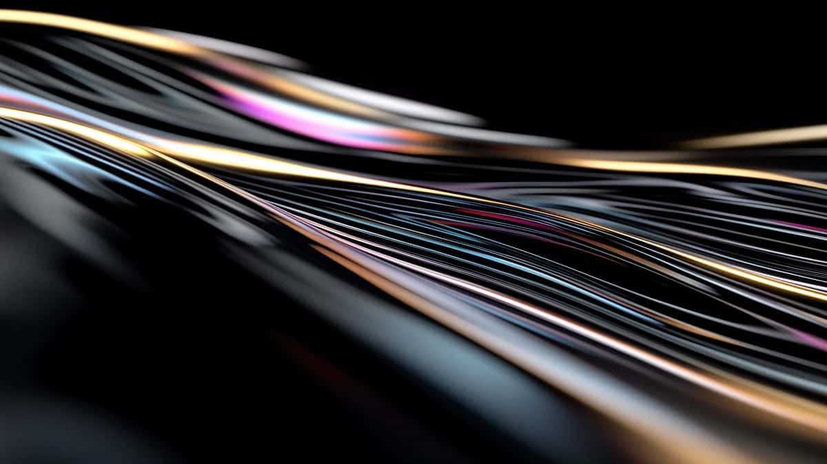 Flowing strands of silver, gold, pink, and blue light streaking across black