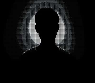 Dithered halftone silhouette of a head and shoulders ringed by a faint grey halo on black