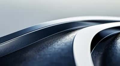 Curved chrome-white and dark navy 3D ribbons flowing over pale grey