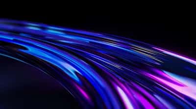 Glossy ribbons of electric blue, violet and magenta sweeping across deep black