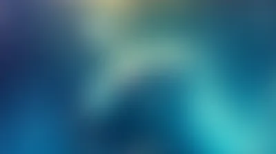 Smooth blurred gradient of navy, teal and cyan with faint warm glow